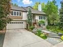 Charming home featuring a stone stairway, a two car garage and beautiful landscaping at 3835 Norwood Ct, Boulder, CO 80304