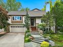 Charming home featuring a stone stairway, a two car garage and beautiful landscaping at 3835 Norwood Ct, Boulder, CO 80304