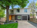 Charming two-story home with a well-maintained lawn and a modern color scheme at 404 W Cleveland St, Lafayette, CO 80026