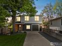 Beautiful home with a well-manicured lawn, mature tree and private driveway at 404 W Cleveland St, Lafayette, CO 80026