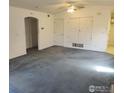 Spacious living room features neutral walls, plush carpeting, and abundant natural light at 50 19Th Ave, Longmont, CO 80501