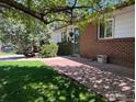 View of brick exterior and walkway leading to the entrance at 700 33Rd St, Boulder, CO 80303