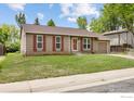 Charming single-story home with a well-maintained lawn and a one-car garage in a suburban setting at 852 W Linden St, Louisville, CO 80027