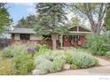 Charming single-story home with brick facade and mature landscaping at 1110 Hartford Dr, Boulder, CO 80305