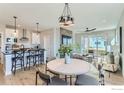 Open floor plan seamlessly connects the kitchen, dining area, and bright living room at 2731 Crystal Springs Ln, Longmont, CO 80503