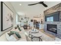 Inviting living room showcases a cozy fireplace and provides access to the dining area and kitchen at 2731 Crystal Springs Ln, Longmont, CO 80503