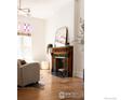 Inviting living room featuring a fireplace, bright window, and stylish decor at 2808 N Humboldt St, Denver, CO 80205