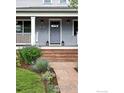 Charming home entrance with stone steps, manicured landscaping, and stylish outdoor lighting at 3561 4Th St, Boulder, CO 80304