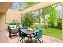 Inviting covered patio with comfortable seating and dining area, perfect for outdoor entertaining at 3805 Northbrook Dr # A, Boulder, CO 80304