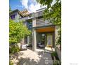 Charming two-story home with lush landscaping and a cozy front porch seating area at 5060 Pierre St # B, Boulder, CO 80304