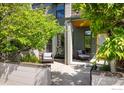 Charming two-story home with lush landscaping and a cozy front porch seating area at 5060 Pierre St # B, Boulder, CO 80304