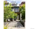 Charming two-story home with lush landscaping and a cozy front porch seating area at 5060 Pierre St # B, Boulder, CO 80304