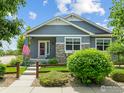 Inviting single-Gathering home with stone accents, well-maintained landscaping, and a quaint fenced yard at 603 Summer Hawk Dr, Longmont, CO 80504