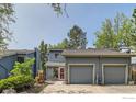 Inviting two-story home with a two-car garage surrounded by mature trees at 1110 Poplar Ave, Boulder, CO 80304