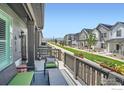 Relaxing front porch with comfortable seating and a view of the neighborhood at 14553 W 91St Dr # A, Arvada, CO 80005