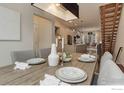 Charming dining area with a rustic wooden table, stylish seating, and ample natural light at 2139 N Downing St, Denver, CO 80205