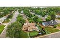 Aerial view of a home nestled among lush greenery, showcasing its neighborhood setting and backyard at 2500 Danbury Dr, Longmont, CO 80503