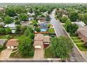 Aerial view of a charming neighborhood featuring mature trees and well-maintained homes at 2500 Danbury Dr, Longmont, CO 80503