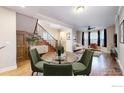 Open-concept dining area with hardwood floors and ample natural light from the large windows at 3931 Osage St, Denver, CO 80211