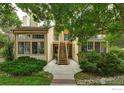 Inviting exterior view showcasing a two-story home with a private entrance and lush greenery at 4887 White Rock Cir # D, Boulder, CO 80301