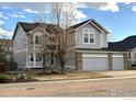 Charming two-story home featuring a spacious three-car garage, professional landscaping, and great curb appeal at 5603 Pierson Mountain Ave, Longmont, CO 80503