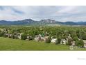 Aerial view of the property showcasing lush greenery and mountain views at 5695 Aurora Pl, Boulder, CO 80303