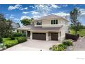 Two-story home featuring a three-car garage, well-manicured landscaping, and a welcoming entrance at 5695 Aurora Pl, Boulder, CO 80303
