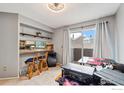 Cozy dining area features a breakfast bar and balcony access at 6710 W 84Th Way # 19, Arvada, CO 80003