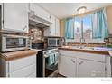 Well-appointed kitchen featuring stainless steel appliances and ample cabinet space at 6710 W 84Th Way # 19, Arvada, CO 80003