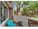 Relaxing outdoor patio featuring a comfortable seating area surrounded by lush greenery at 6710 W 84Th Way # 19, Arvada, CO 80003