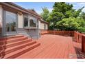 Large wooden deck with steps, great for entertaining and enjoying the outdoor space at 1020 10Th St, Boulder, CO 80302