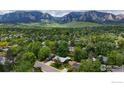 Panoramic aerial view of a residential neighborhood with mountain views in the background at 1025 Edinboro Dr, Boulder, CO 80305