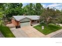 Charming single Gathering home with a well-maintained lawn and a two car garage at 1025 Edinboro Dr, Boulder, CO 80305