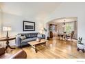 Open concept living and dining room with hardwood floors at 1641 Cedarwood Dr, Longmont, CO 80504