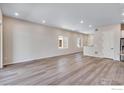 Expansive living room with sleek floors and neutral walls offering a bright and airy feel at 1790 Mount Meeker Ave, Berthoud, CO 80513