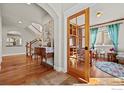 Inviting foyer with hardwood floors and staircase leading to upper level at 2005 Calico Ct, Longmont, CO 80503