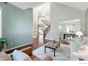 Inviting living room featuring an open layout, hardwood floors, and neutral décor at 2133 Indian Peaks Cir, Longmont, CO 80504