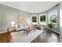 Bright living room featuring hardwood floors, neutral décor, and natural light at 2133 Indian Peaks Cir, Longmont, CO 80504