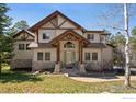 Inviting two-story home with stone accents and a welcoming front porch at 23 Hess Ave, Golden, CO 80401