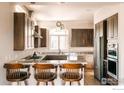 Gourmet kitchen featuring custom cabinets, granite countertops, and stainless steel appliances at 4993 Clubhouse Ct, Boulder, CO 80301