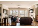 Spacious living room with hardwood floors, fireplace, and sliding doors to backyard at 4993 Clubhouse Ct, Boulder, CO 80301