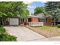 Attractive single-Gathering home with brick, large front yard, and driveway leading to garage at 800 Mohawk Dr, Boulder, CO 80303