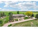 Expansive property with lush greenery and a well-maintained home, offering a serene and private setting at 10141 Yellowstone Rd, Longmont, CO 80504