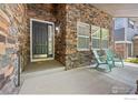 Welcoming entrance featuring a stylish front door, stone accents, and comfortable seating area for guests at 14246 Piney River Rd, Broomfield, CO 80023