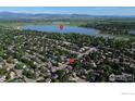 Breathtaking aerial view showcases a neighborhood near McIntosh Lake with mountain views at 1600 Harvard St, Longmont, CO 80503