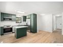 Bright kitchen boasts stainless steel appliances and lots of space for cooking at 1600 Harvard St, Longmont, CO 80503
