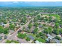 Expansive aerial view showcasing the neighborhood and surrounding green spaces at 1868 Princess Dr, Longmont, CO 80501