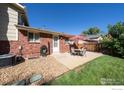 Cozy outdoor patio with seating area, ideal for relaxation and entertaining in a private backyard at 2132 Gay St, Longmont, CO 80501