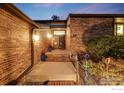 A welcoming entryway with brick steps, handrails, and well-maintained landscaping leading to the front door at 2777 S Elmira St # 17, Denver, CO 80231