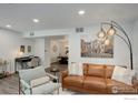 Bright living room area features comfortable seating and stylish decor at 2802 Sundown Ln # 210, Boulder, CO 80303